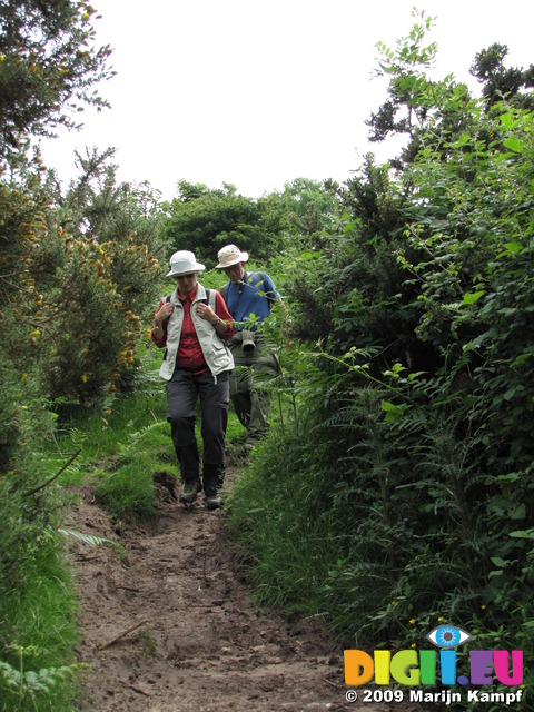 SX06882 Machteld and Hans walking down slippery trail